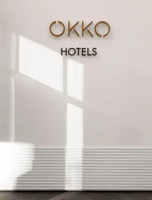 a sign for okio hotels is pictured at a store at OKKO Hotels Cannes Centre in Cannes