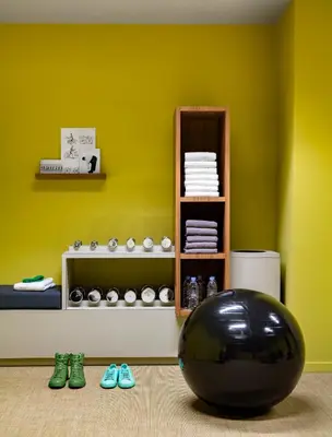 a room with a black ball and some shoes at OKKO Hotels Cannes Centre in Cannes