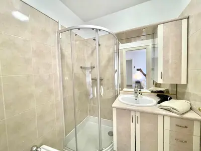 a bathroom with a shower and a sink at Cannes Center by Welcome to Cannes in Cannes