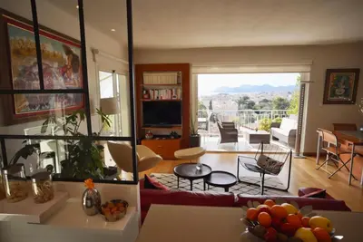 a living room with a view of a living room at Appartement chic à Cannes, avec terrasse et cheminée, 83 m² in Cannes