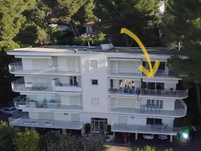 an aerial view of a white building with a yellow funnel at Appartement chic à Cannes, avec terrasse et cheminée, 83 m² in Cannes