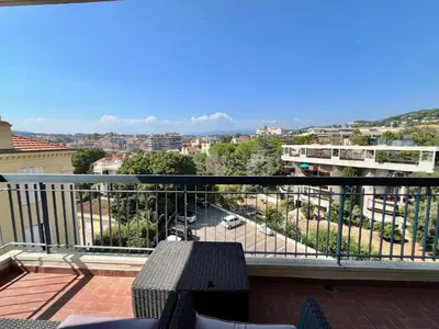 a balcony with a view of a city at Méditerranée by Welcome to Cannes in Cannes