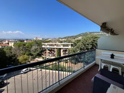 a balcony with a view of a city at Méditerranée by Welcome to Cannes in Cannes
