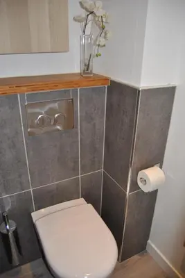 a bathroom with a toilet and a roll of toilet paper at Le Calme au Centre Ville à 10 minutes à pied de la Croisette et des plages in Cannes