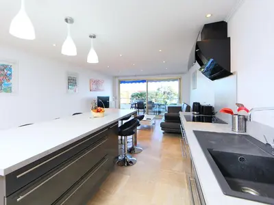 a kitchen with a sink and a counter top at Apartment Lerins by Interhome in Cannes