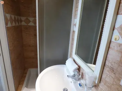 a bathroom with a sink and a shower with a mirror at ALC - MOL6 - 9 min Palais and 5 min Beaches in Cannes
