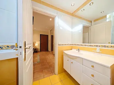 a bathroom with a sink and a mirror at Viva Riviera Residence Commandant André in Cannes