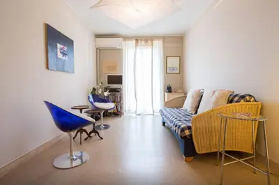 a living room with a couch and chairs in it at Large 1 Bedroom with Balcony City Centre in Cannes