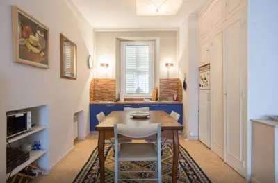 a dining room with a table and two chairs at Large 1 Bedroom with Balcony City Centre in Cannes