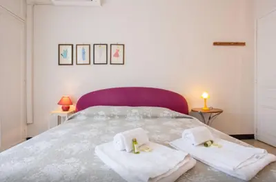 a bedroom with a bed with towels on it at Large 1 Bedroom with Balcony City Centre in Cannes