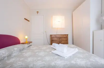a bedroom with a bed with white towels on it at Large 1 Bedroom with Balcony City Centre in Cannes