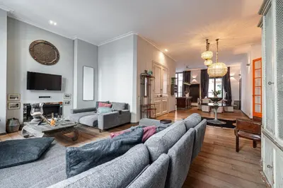a living room with a couch and a table at The Cosmopolitan Lodge in Cannes
