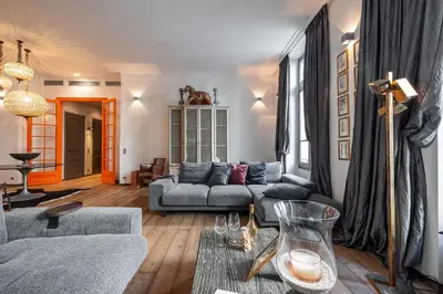 a living room with a couch and a table at The Cosmopolitan Lodge in Cannes