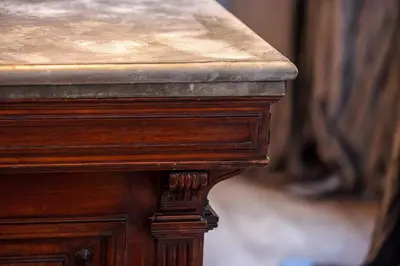 a close up of a wooden table with a wooden at The Cosmopolitan Lodge in Cannes