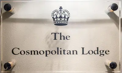 a sign with a crown on top at The Cosmopolitan Lodge in Cannes