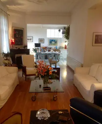a living room with a couch and a table at Villa Prétorina in Cannes