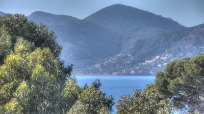 a view of a lake with mountains in the background at Beau 2 pièces 3 étoiles Vue Mer Garage Privé 150m plages wifi in Cannes