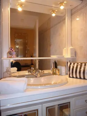 a picture on a white wall with a frame at lovely apartments with terrace in Cannes