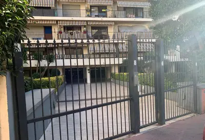 an iron fence in front of a building at Arènes by Welcome to Cannes in Cannes