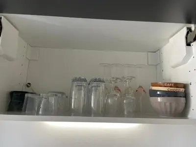 a row of glass jars sitting on a shelf at Le Suquetan in Cannes