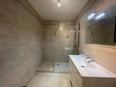a bathroom with a sink and a shower at Le Suquetan in Cannes