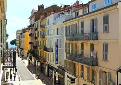 a group of buildings on a city street at Lovely and Modern 1 Bedroom City Centre Cannes in Cannes
