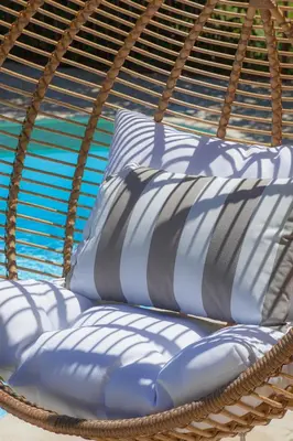 a bunch of pillows in a rattan basket at Villa Le Port d'attache in Vallauris
