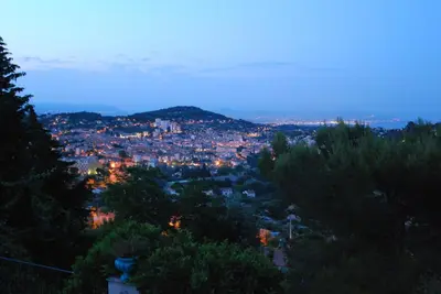 a view of a city at night at Villa Le Port d'attache in Vallauris