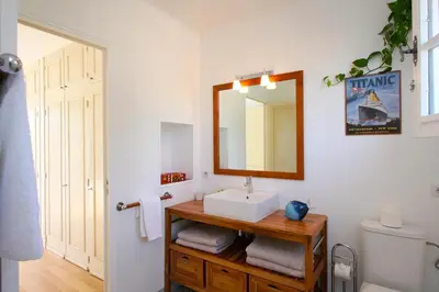 a bathroom with a sink and a mirror at Villa Le Port d'attache in Vallauris