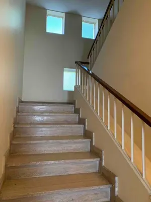 a set of stairs in a home with two windows at Ô Béatrice Croisette in Cannes