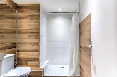a bathroom with a shower and a toilet at Studio Cosy Merle in Cannes