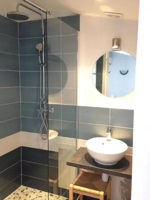 a bathroom with a sink and a mirror at Suquet Charm in Cannes