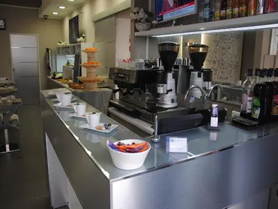 a kitchen with a counter with a coffee maker at Riviera Eden Palace in Cannes