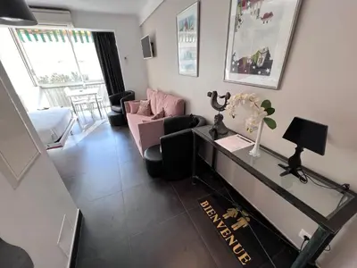 a living room with a couch and a table at Riviera Eden Palace in Cannes