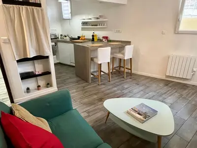 a living room with a couch and a table at Appartement Le Suquet proche Croisette in Cannes