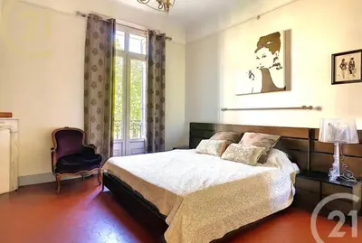 a bedroom with a bed and a window at Chez Grace in Cannes
