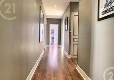an empty hallway with wood floors and walls and a hallway with a hallway at Chez Grace in Cannes