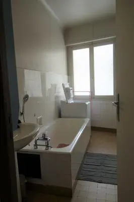 a white bathroom with a tub and a sink at Themis by Welcome to Cannes in Cannes