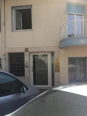a car parked in front of a building with a balcony at Themis by Welcome to Cannes in Cannes
