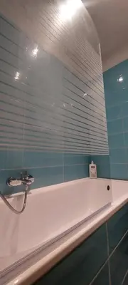 a bathroom with a bath tub with a window at Cannes Riviera in Cannes