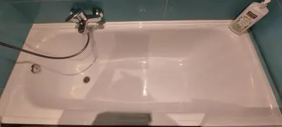 a white bath tub with a faucet in a bathroom at Cannes Riviera in Cannes