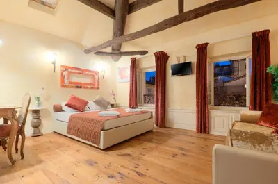 a bedroom with a bed and a couch at Charming house in Cannes