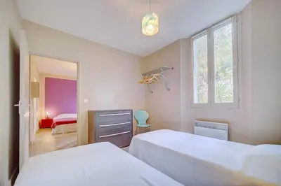 a bedroom with two beds and a window at IMMOGROOM - SEA View on the Port - Next to the beaches - AC - Wifi in Cannes