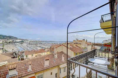 a view from the balcony of a building at IMMOGROOM - SEA View on the Port - Next to the beaches - AC - Wifi in Cannes