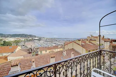 a view of a city from a balcony at IMMOGROOM - SEA View on the Port - Next to the beaches - AC - Wifi in Cannes
