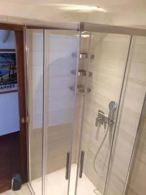 a shower with a glass enclosure in a bathroom at Le Suquet Style by Connexion in Cannes
