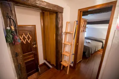 a room with a bed and a door and a bedroom at Le Suquet Style by Connexion in Cannes