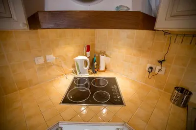 a kitchen counter with a stove top in a kitchen at Le Suquet Style by Connexion in Cannes