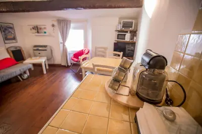 a kitchen and living room with a coffee maker on a counter at Le Suquet Style by Connexion in Cannes