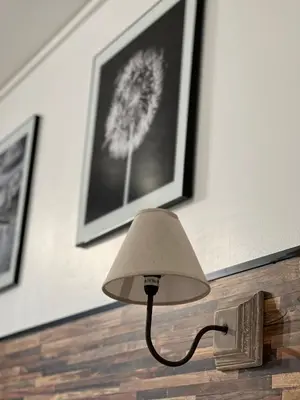 a lamp sitting on a table with a book at Resothel Group in Le Cannet